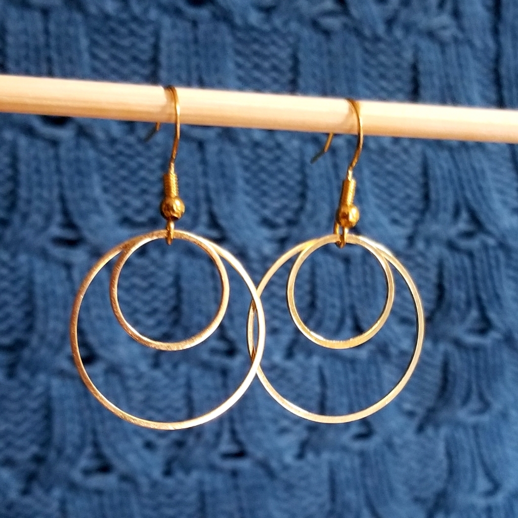 Chunky gold hoop earrings photographed for a marketplace product listing